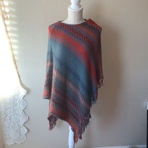 Ryan Michael Sunset mirrored asymmetrical poncho with chevron fringe on left